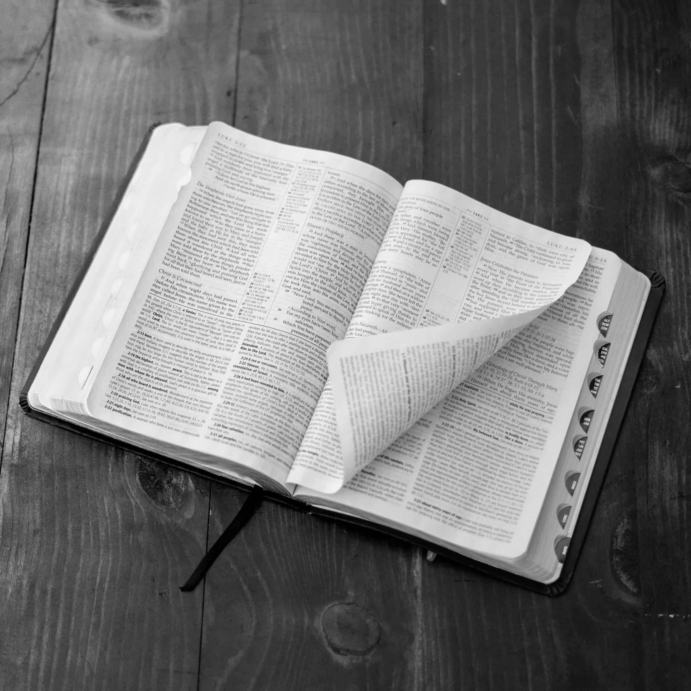 Open Bible on a wood table